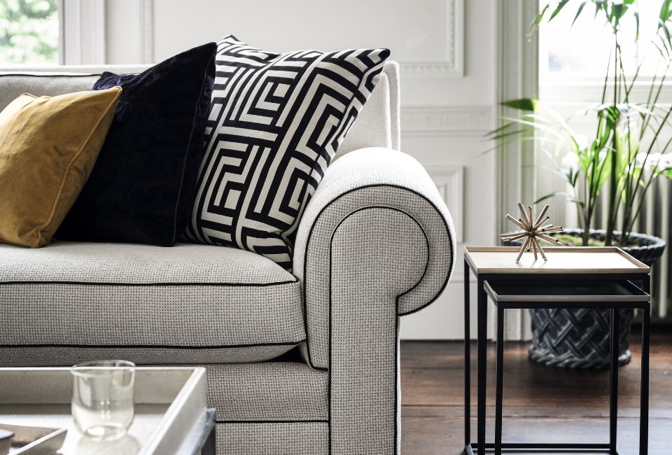 Inspired by Parisian Art Deco design, the Coco range brings together grand proportions and timeless British elegance. Its commanding presence is balanced by refined detailing, creating a statement piece that feels both sophisticated and inviting.

The elegantly high back offers a sense of structure and support, while the beautifully detailed scrolled arms add a touch of classic charm and craftsmanship. Together, these design elements create a silhouette that is as striking as it is graceful - perfectly suited to both traditional and contemporary interiors.

The result is a collection that captures the essence of understated luxury, where bold design meets enduring style.
