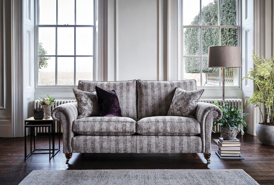 The Belvedere is a beautifully timeless design that showcases a wealth of traditional features and refined English styling. From its gracefully scrolled arms to its elegantly raised wooden feet with classic castors, every detail has been thoughtfully considered to reflect heritage craftsmanship and understated luxury. Its well-proportioned silhouette and tailored upholstery create a sophisticated presence, while the intricate finishing touches enhance its overall charm and character. Designed to complement both classic and transitional interiors, the Belvedere effortlessly brings a sense of elegance, comfort, and enduring style to any living space.
