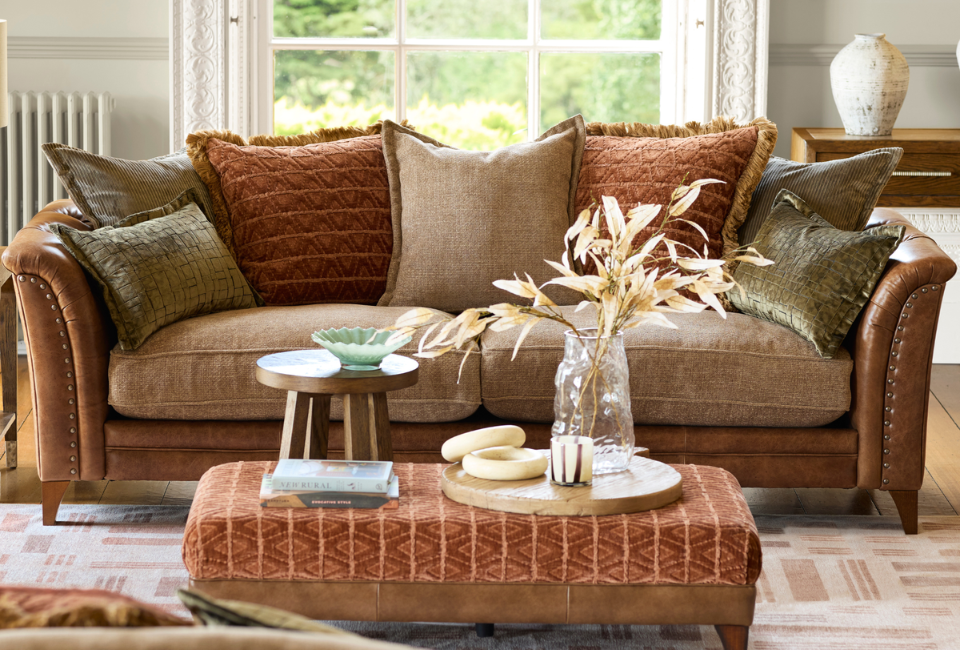 As the evenings become cooler, swap lighter accessories for richer tones such as rust, olive and deep mustard. Layer textured throws, add cosy cushions and introduce warm lighting with table lamps and candles to create a welcoming atmosphere.
