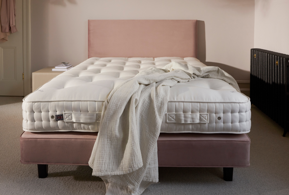 Every Vispring Elite mattress is meticulously handcrafted to the highest standards, combining traditional techniques with exceptional natural materials. At its heart, a hand-nested calico pocket spring system, available in Soft, Medium, Firm or Extra Firm tensions, delivers tailored support with 1,254 individually responsive springs in the King Size model. Layers of luxurious British fleece wool and cotton are encased in a premium breathable ticking and hand-tufted for lasting comfort and stability. Finished with protective wool-upholstered borders, two rows of hand side-stitching, air vents, and horizontal handles, every detail has been carefully considered to provide outstanding comfort, durability, and performance for years to come.
