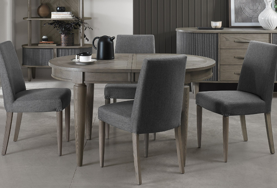 The shape of your dining table can have a big impact on how it fits into your room.

Rectangular tables are ideal for longer dining spaces and larger gatherings, offering generous seating and a traditional layout.

Round tables create a more sociable dining experience and can work particularly well in smaller or square rooms. Many extend into an oval shape, providing additional seating when required.

Oval tables offer a softer alternative to rectangular designs, combining generous dining space with beautifully curved edges.
