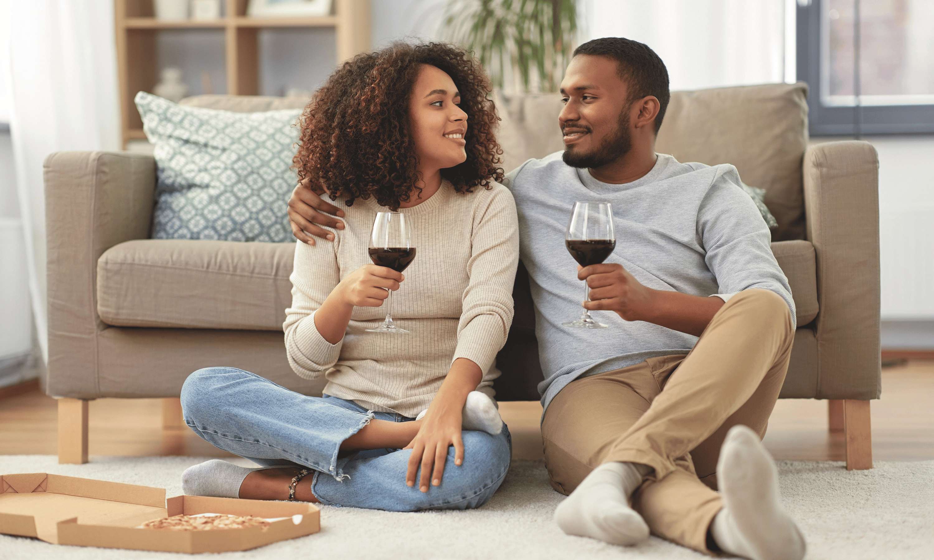couple-with-glass-of-wine-on-sofa---cookes-furniture